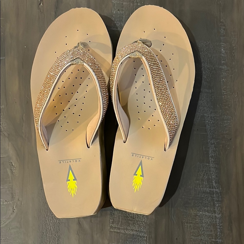 Volatile Tan Wedge Sandals with Thong Straps
Size 8